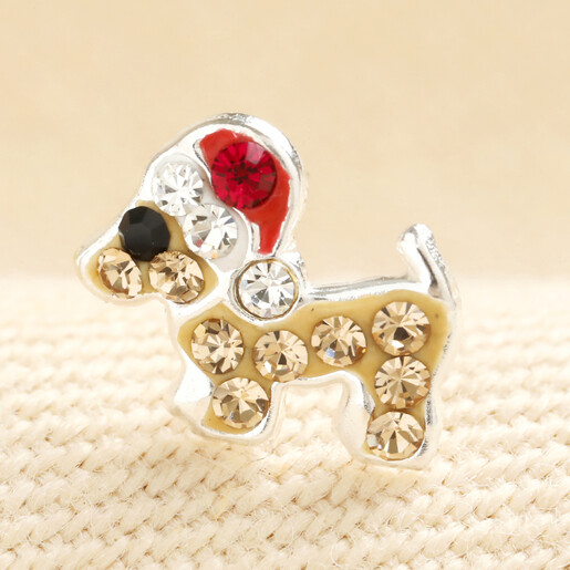 Close-up view of sterling silver sausage dog stud earring with crystal Santa hat