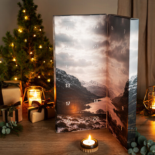 Open Pintail advent calendar styled beside a mini Christmas tree and gifts