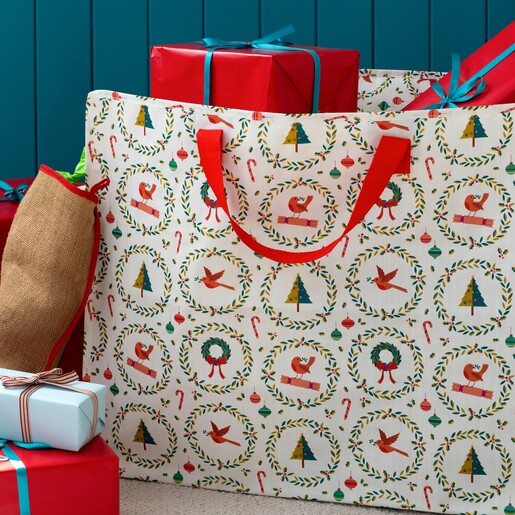 Close-up of festive wreaths and robins on Christmas storage bag