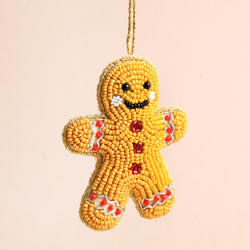Close-up of beaded gingerbread man Christmas ornament showing bead embroidery details