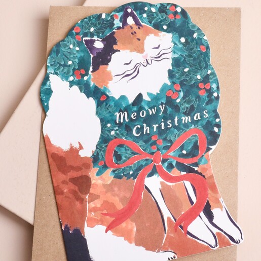 Die-cut cat Christmas card with wreath and festive red ribbon bow