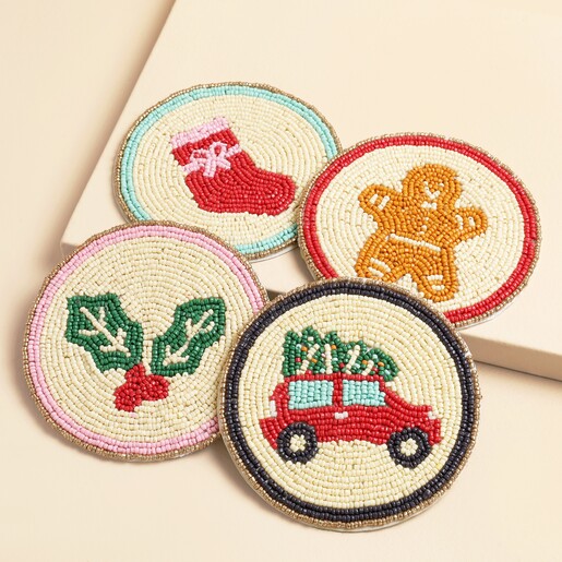 Set of four festive beaded coasters featuring gingerbread man, car, stocking and holly motifs
