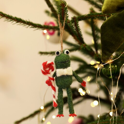 Felt green Christmas frog hanging decoration holding a striped swirl lollipop