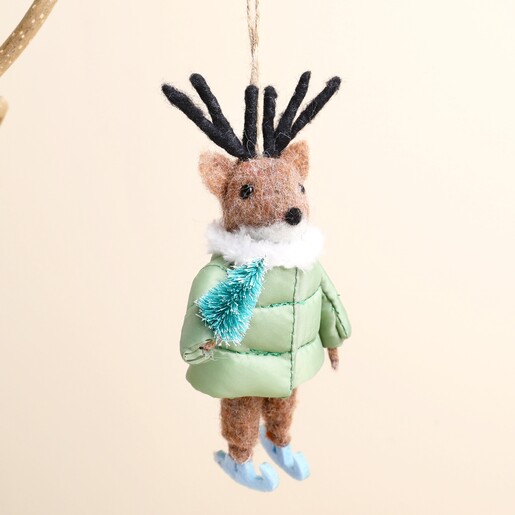 Close-up of reindeer felt Christmas hanging decoration with green jacket and mini tree