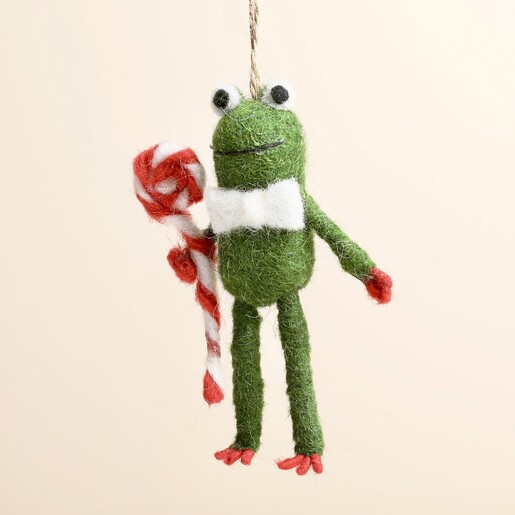 Close up of the felt frog decoration with white bow tie and lollipop