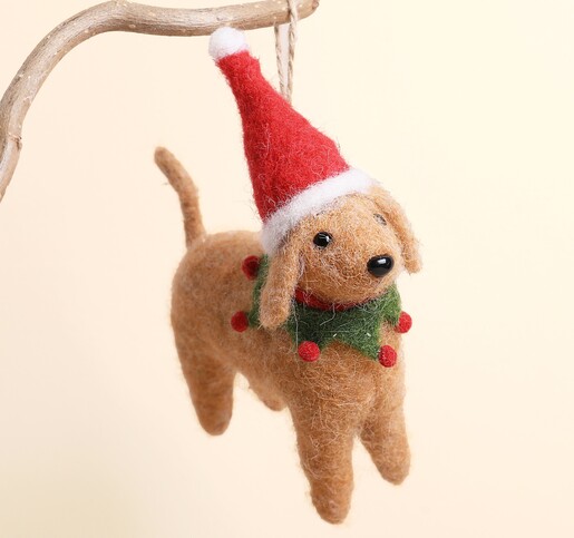 Close-up of the needle felt dog Christmas decoration with festive hat