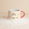 Ceramic winter wishes mug with raised townhouse illustration and candy cane handle