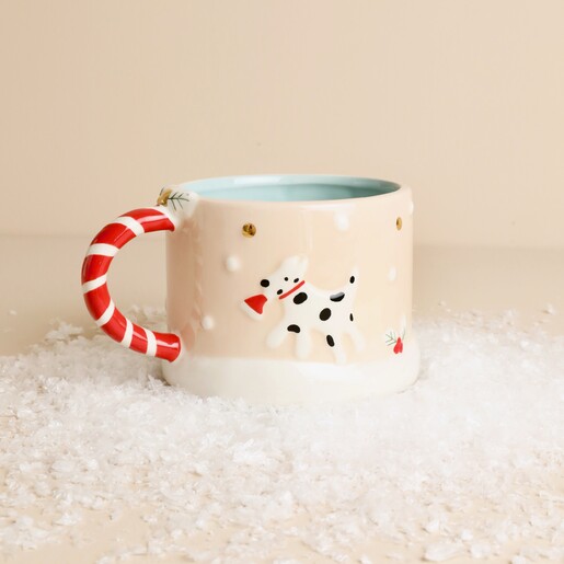 Ceramic winter wishes mug displaying embossed dalmatian holding a santa hat