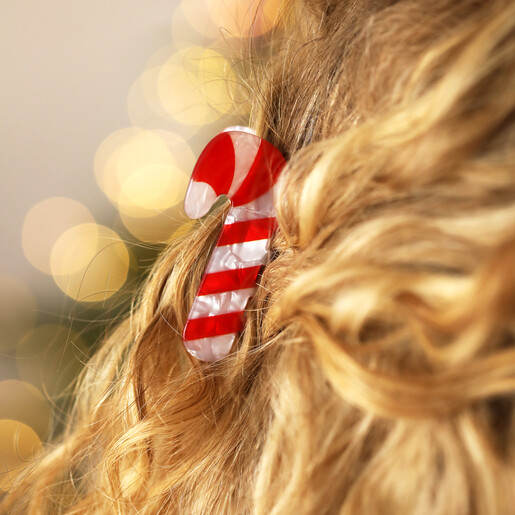 candy cane-shaped hair clip on model