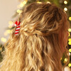 red and white hair clip on blonde hair 