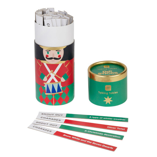 Open Nutcracker dip stick game tube showing sticks with charades and shout out prompts.