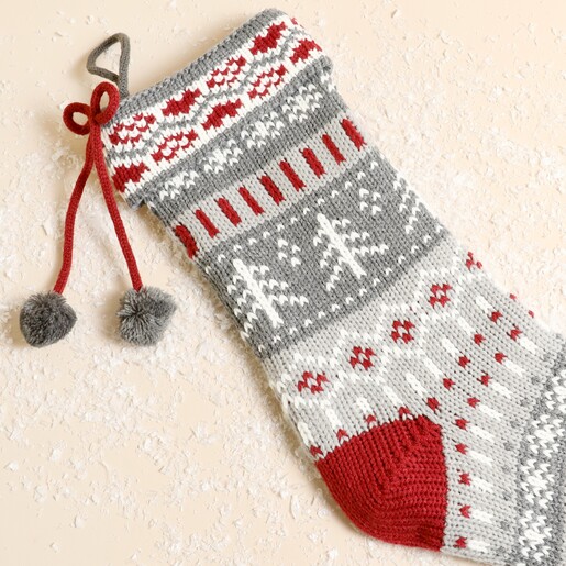 Close-up of Fair Isle pattern and pom-pom detail on stocking