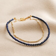 Blue Double Layer Stone Beaded Bracelet in Gold on neutral coloured fabric