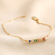 Colourful Gemstone Bar Bracelet in Gold on Beige Fabric