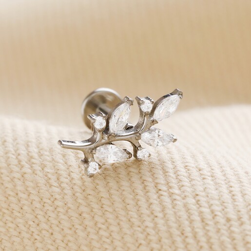 Titanium Crystal Fern Leaf Helix Earring on neutral coloured fabric