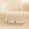 Sterling Silver Pastel Crystal Horizontal Bar Necklace on top of beige coloured fabric