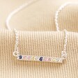 Sterling Silver Pastel Crystal Horizontal Bar Necklace on top of beige coloured fabric
