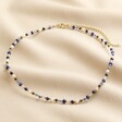 Semi-Precious Stone Bead Necklace in Blue on beige fabric